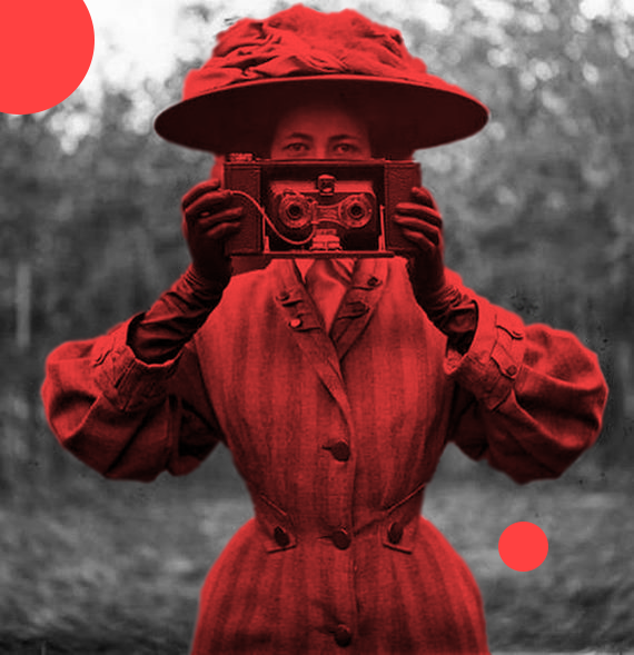 Woman holding a stereographic camera, black and white, with red highlight